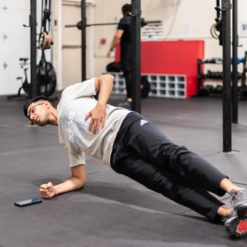 Man do stretching at Mass Strength and Conditioning